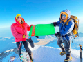 The State Flag of Turkmenistan raised on the summit of Mount Elbrus